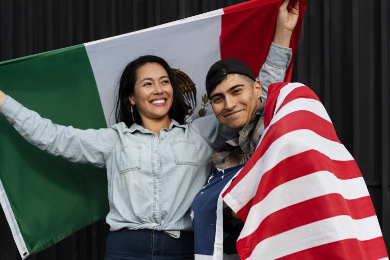 Woman with Mexican flag and man draped in American flag illustrate blog "Where Does the Word 'Chicano' Come From?"