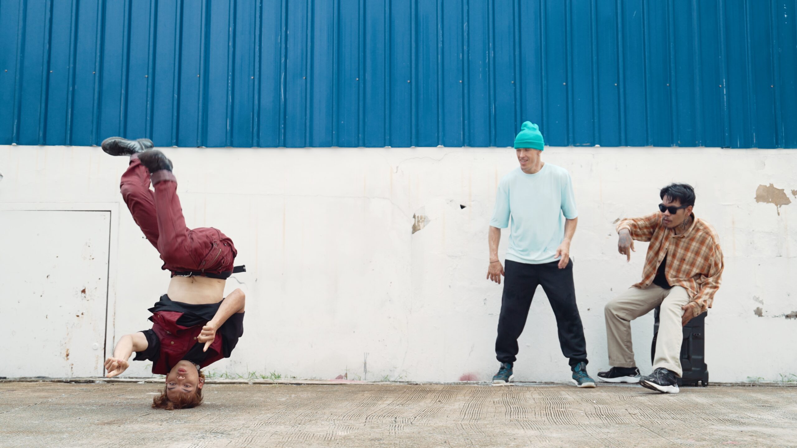 Young street dancer dancing in hip hop style with friend cheer behind. Endeavor.